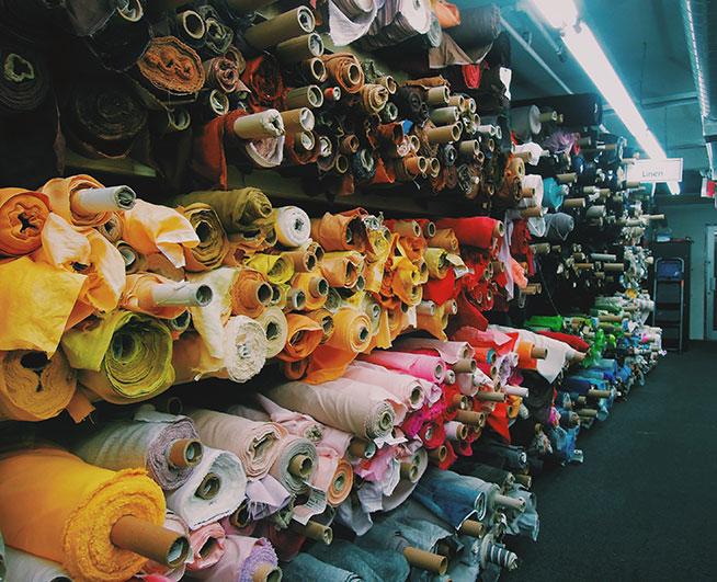 About History different color fabrics placed on the shelf